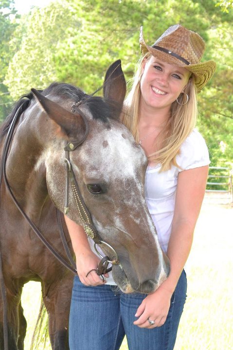 Woman caring for horse