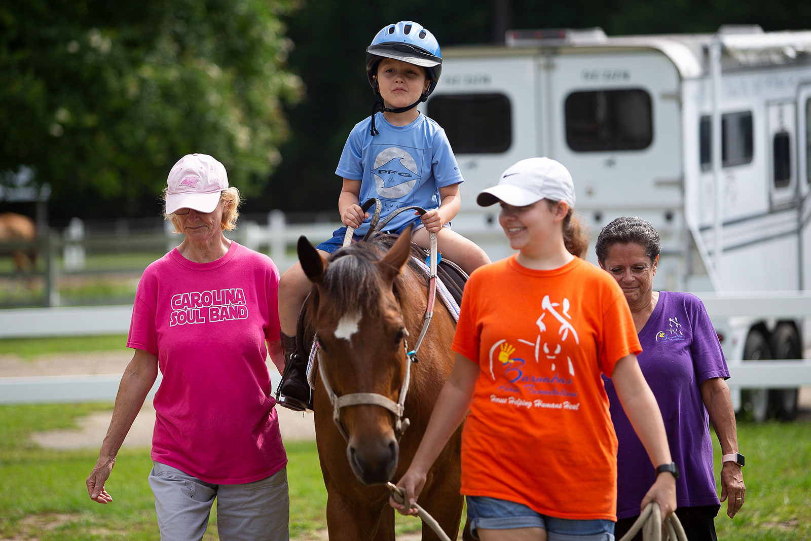 Child riding a horse